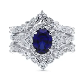 Halo Simulated Blue Sapphire Oval CZ Ring Set in Sterling Silver