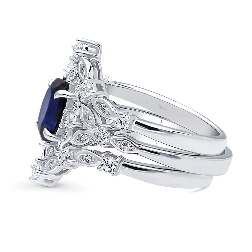 Halo Simulated Blue Sapphire Oval CZ Ring Set in Sterling Silver