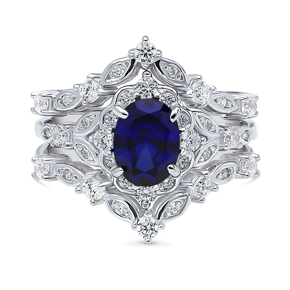 Halo Simulated Blue Sapphire Oval CZ Ring Set in Sterling Silver